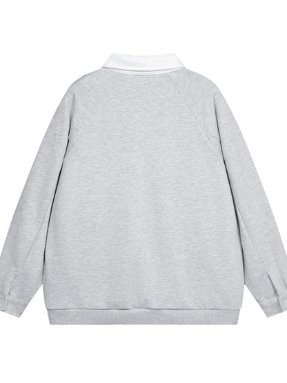 This men’s long-sleeve polo sweatshirt combines a contrasting-letter design with comfortable, versatile styling for casual or sporty looks.