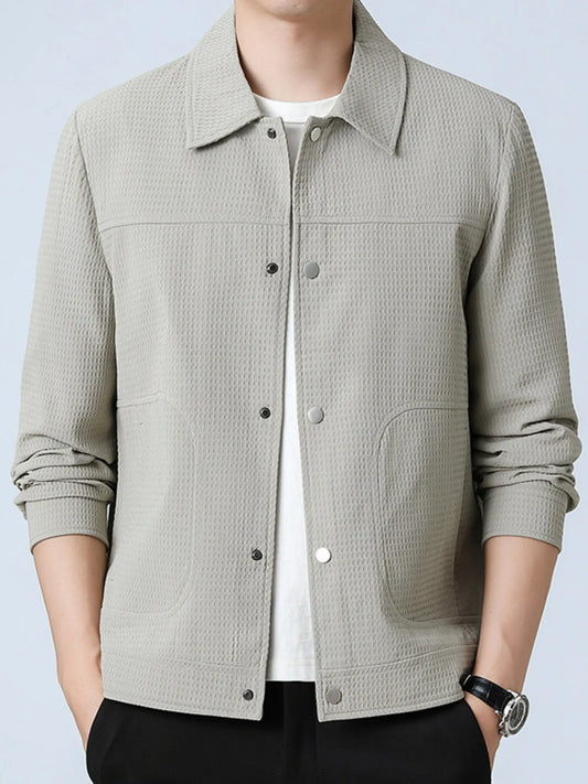 Men’s light gray button-up long sleeve jacket with side pockets, worn over a white t-shirt