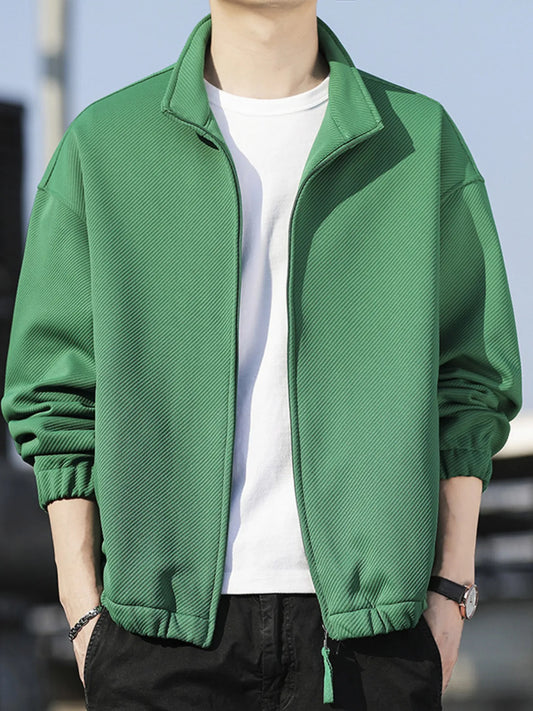 Men’s green zip-up long sleeve jacket  worn over a white t-shirt