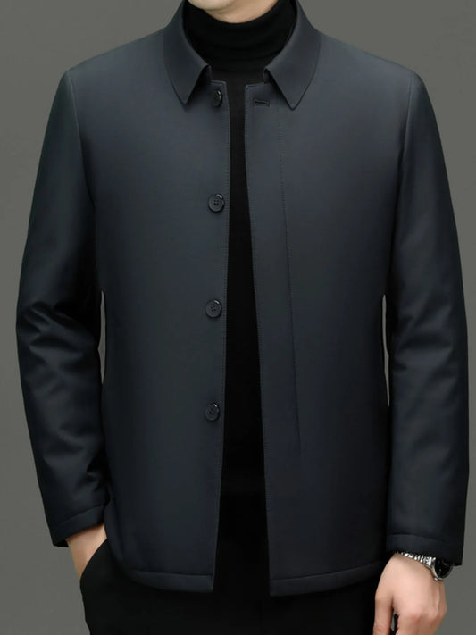 Men’s dark gray button-up long sleeve jacket  worn over a black turtle neck