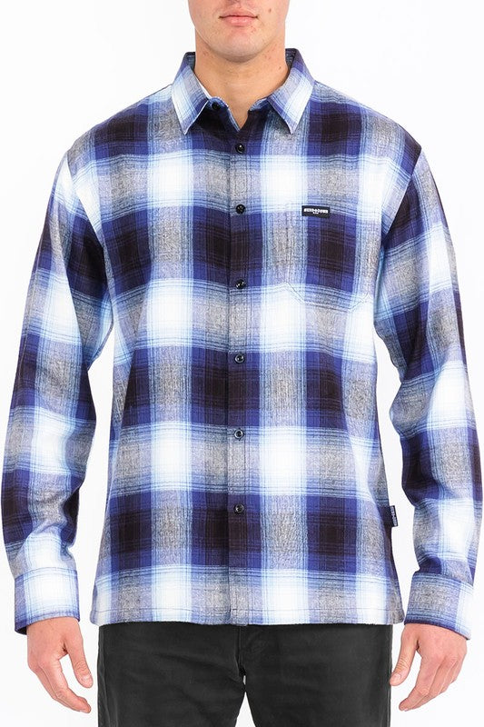 This men's plaid long-sleeve flannel shirt combines classic patterning with soft, breathable fabric for timeless comfort and versatile, everyday style.