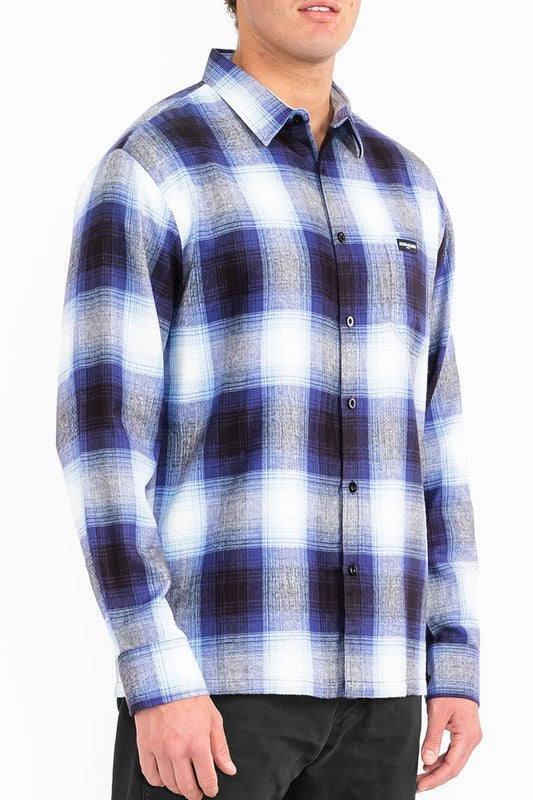 This men's plaid long-sleeve flannel shirt combines classic patterning with soft, breathable fabric for timeless comfort and versatile, everyday style.