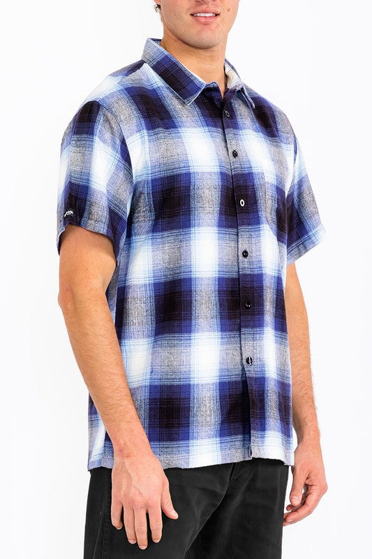 This men's plaid short-sleeve flannel offers a lightweight, breathable feel with a classic tartan pattern, making it a versatile casual layer for cooler days.