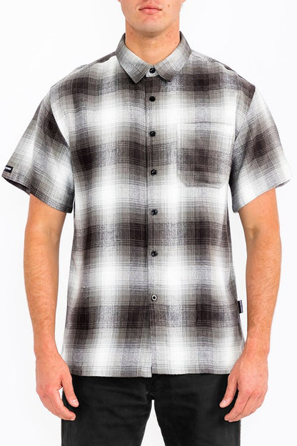 This men's plaid short-sleeve flannel offers a lightweight, breathable feel with a classic tartan pattern, making it a versatile casual layer for cooler days.
