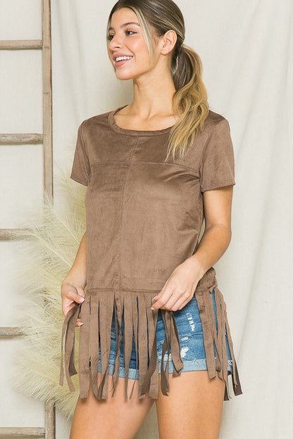This fringe top adds movement and texture to any simple outfit.
