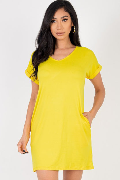 Woman wearing a yellow dress against a white background