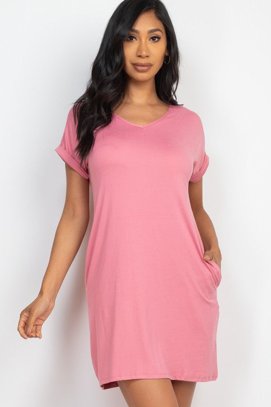 Woman wearing a pink dress against a white background