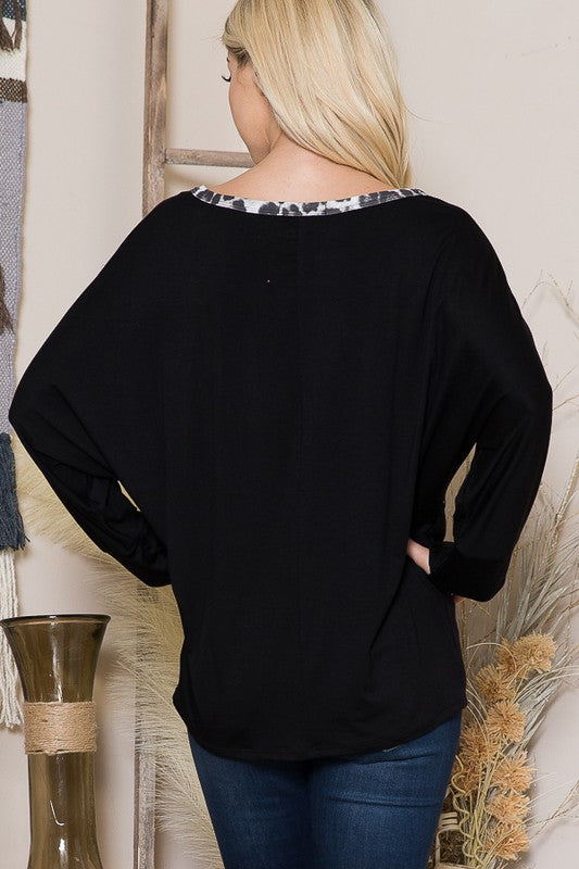 A chic layering piece that combines texture, shape, and thumbhole utility.