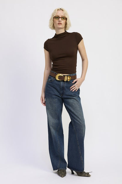 Relaxed fit, modeled by someone 5'9" wearing size Small, so it drapes nicely. 