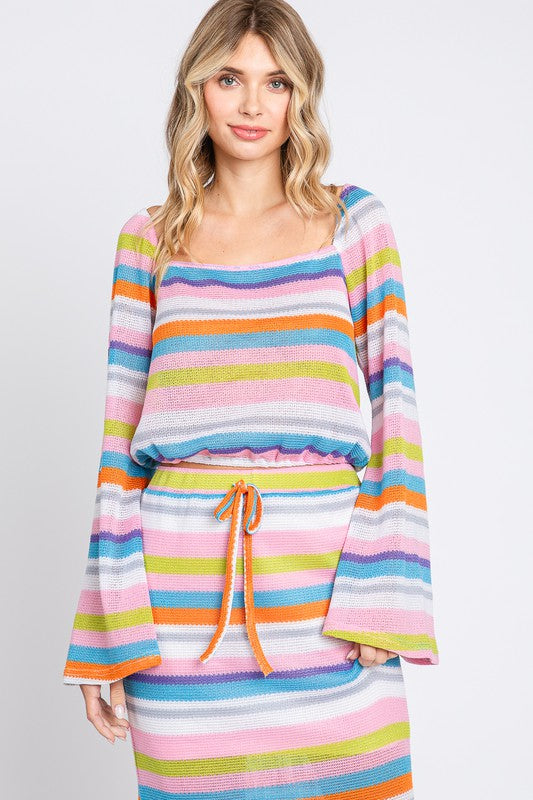 Bold multi-colored stripes meet a cropped cut for instant seasonal flair.