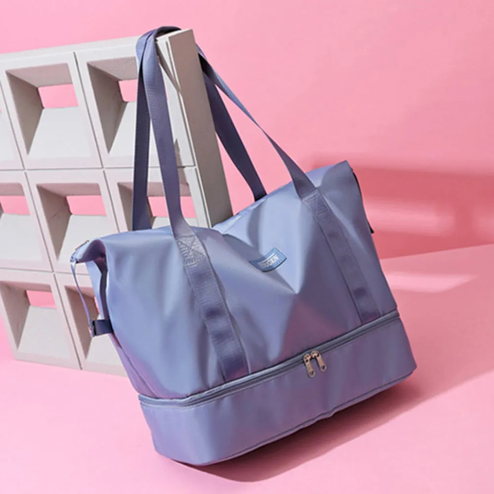 Lavender tote bag with pink straps and a zippered bottom compartment, set against a pink backdrop with geometric decor. Sleek and functional—great for gym, travel, or daily use.