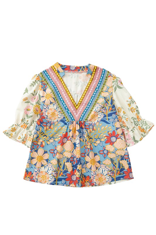 A staple floral blouse that adds pop and personality to any outfit.