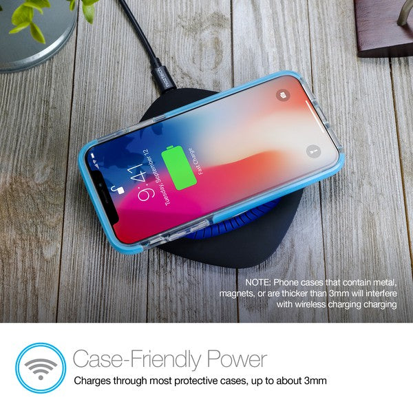 A black Naztech wireless charging pad with a glowing blue ring, actively charging a smartphone via Qi technology. Includes a USB wall adapter.