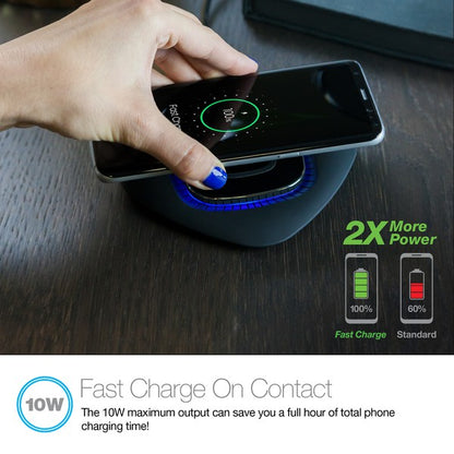 A black Naztech wireless charging pad with a glowing blue ring, actively charging a smartphone via Qi technology. Includes a USB wall adapter.