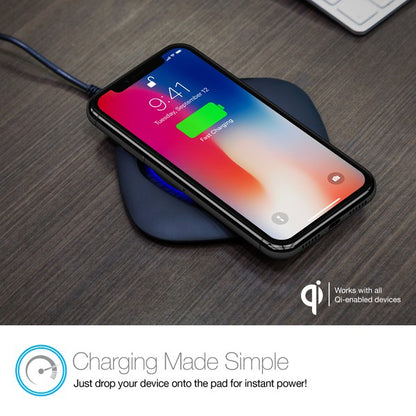A black Naztech wireless charging pad with a glowing blue ring, actively charging a smartphone via Qi technology. Includes a USB wall adapter.