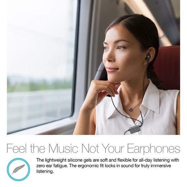 Person wearing in-ear earphones while traveling—promotes soft silicone gels and ergonomic fit for all-day comfort and immersive sound without ear fatigue.