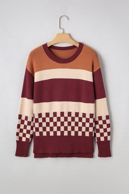 Checkered color block sweater featuring warm tones like rust, burgundy, and cream, with a classic crew neck and ribbed cuffs.