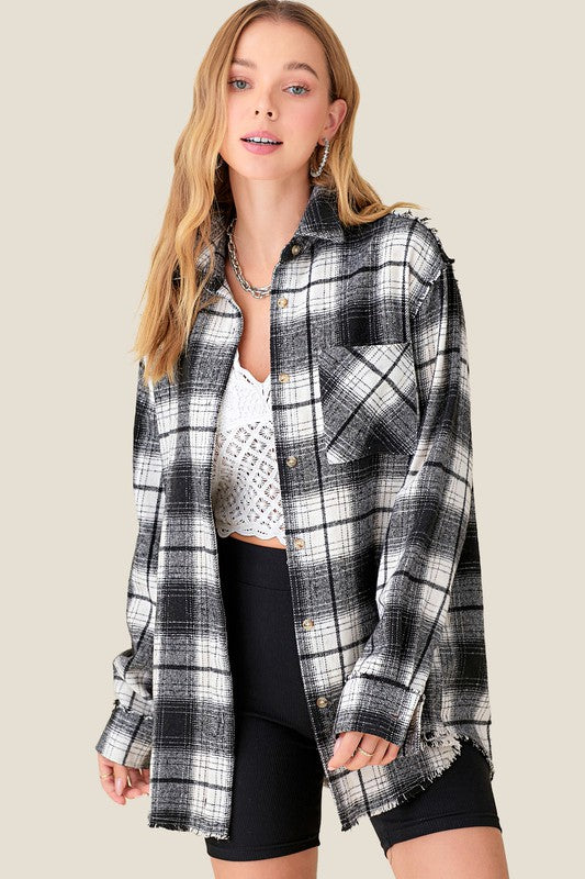 Classic plaid pattern on a relaxed long-sleeve shirt—perfect for casual or semi-dressy looks. 