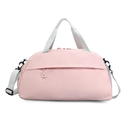 Light pink duffel bag with white handles and a detachable shoulder strap, featuring a front zippered pocket with a triangular pull. Sleek and functional—perfect for gym, travel, or everyday use.
