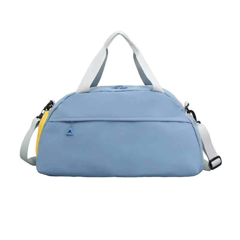 Light blue duffel bag with white handles and a gray shoulder strap featuring black hardware. It has a front zippered pocket with a triangular pull and a small yellow accent—modern, minimal, and perfect for gym or travel.