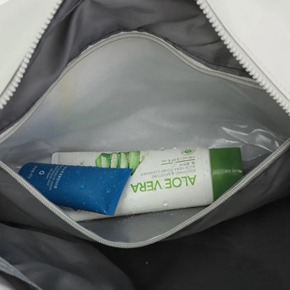 Partially opened travel pouch containing two skincare tubes—one labeled "ALOE VERA" in green and white, and another blue and white tube with water droplets. A clean, organized setup that suggests personal care and travel readiness.