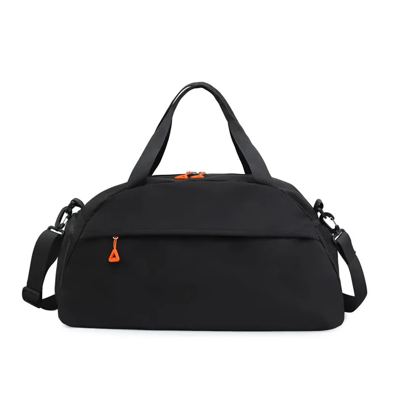 Black duffel bag with orange zipper pulls, featuring short handles and a long adjustable shoulder strap. Sleek and functional design with a front zippered pocket—great for gym, travel, or everyday use, with a pop of color for added style.