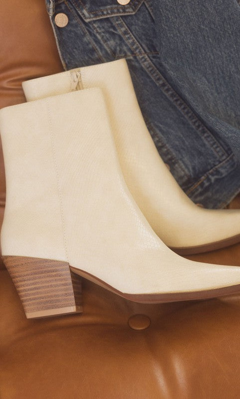 Leather ankle boots with square toe, stacked wooden block heel, side zipper closure, and slip-on style