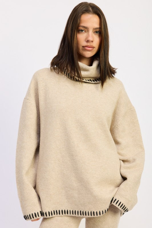 A lady with a brown oversized Turtle Neck Sweater 