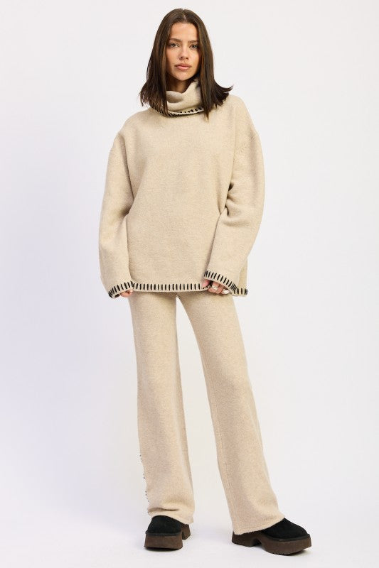 lady wearing an oversized turtle neck sweater