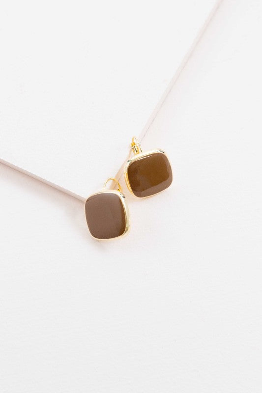 Earthy tone. Effortless style. The On the Go Hook Earrings in Brown are designed for movement, comfort, and understated elegance. With their sleek hook silhouette and warm neutral hue, they’re the perfect accessory to complement your everyday wardrobe—whether you're headed to work, brunch, or a weekend stroll.