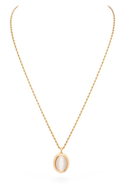A gold necklace with a pendant. The pendant is circular with a light pink stone in the center, surrounded by gold.