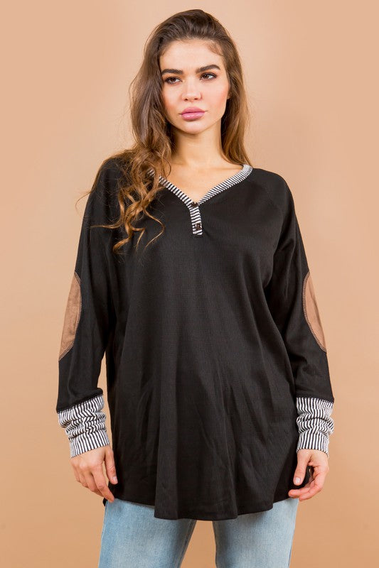 Cozy long sleeves with elbow patches add texture and style to this tunic.