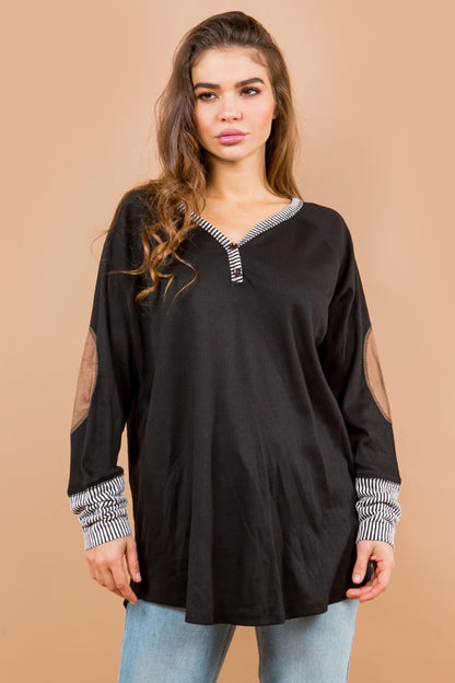Cozy long sleeves with elbow patches add texture and style to this tunic.