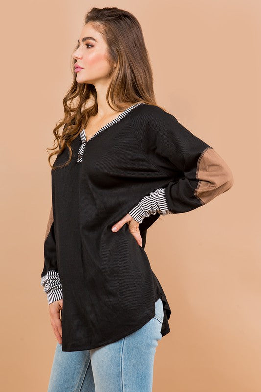 The suede elbow patches bring a subtle edge to an oversized everyday tunic.