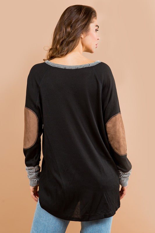 Flowy, oversized fit plus elbow patch accents make this tunic both comfy and chic.