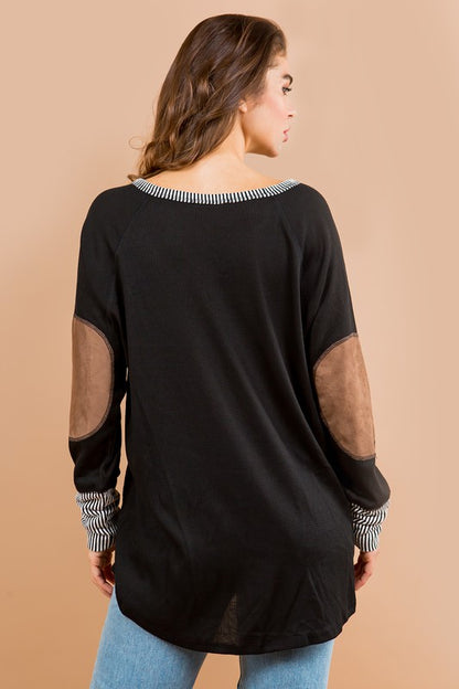 Flowy, oversized fit plus elbow patch accents make this tunic both comfy and chic.