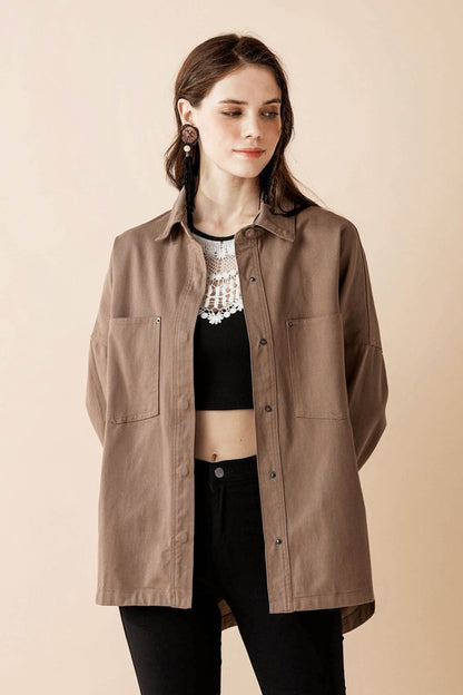 Front patched pocket and curved hemline blend utility with style.