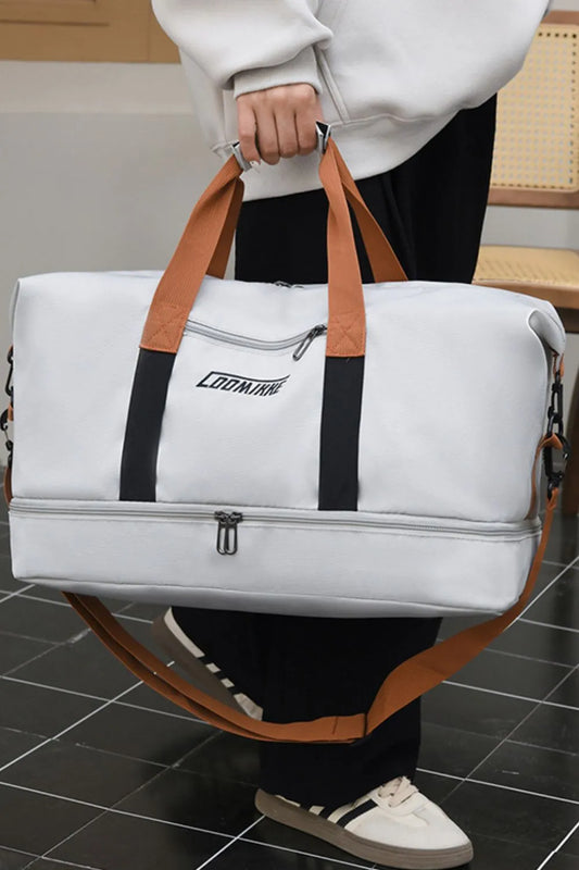 Large white duffel bag with brown and black straps, featuring a bottom zipper compartment and “CONNMAY” branding. Shown carried by a person in casual attire—ideal for travel or gym use.