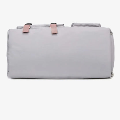 Light gray duffel bag with pink handles and shoulder strap, featuring a front zip pocket and smooth, slightly glossy material. Modern and functional—ideal for gym, travel, or everyday use.