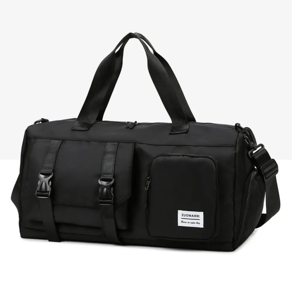 Black duffel bag with top handles and a detachable shoulder strap. Features include a front zip pocket and a buckle-strap compartment. Durable and versatile—ideal for travel, gym, or daily use.