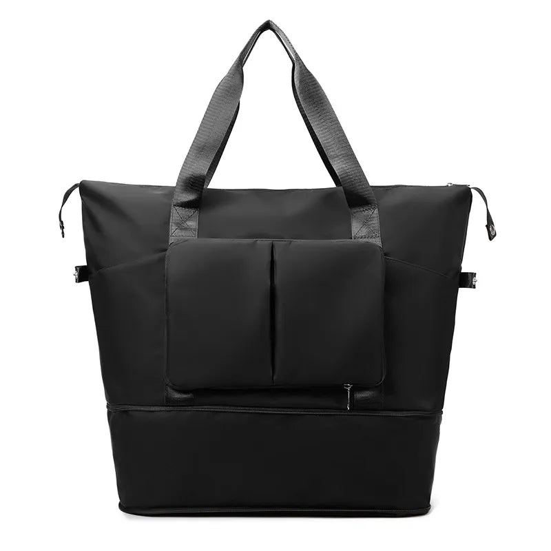 Sleek black travel or gym bag with sturdy textured shoulder straps, dual vertical front pockets with flap, and a reinforced base. Designed for durability and spacious storage—ideal for active or travel lifestyles.