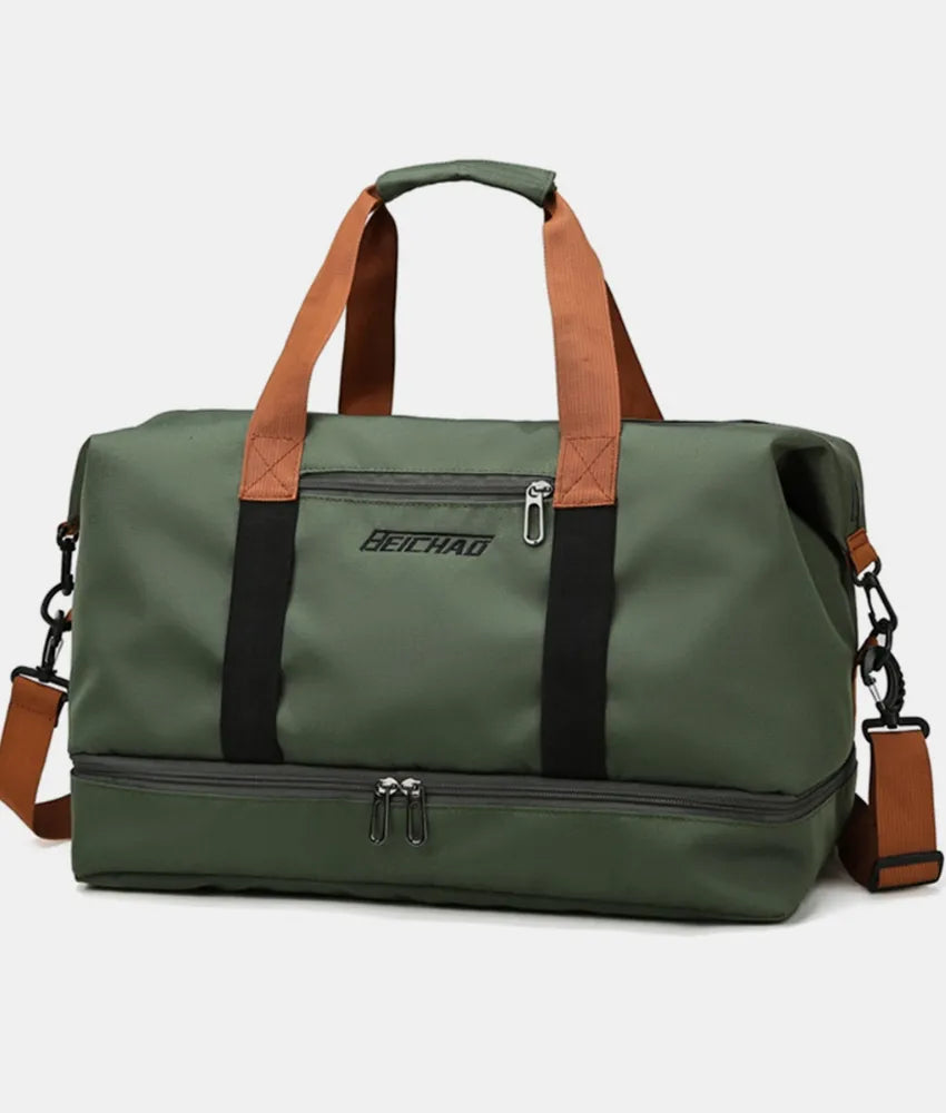 Green duffel bag with brown handles and black straps, featuring top and bottom zippered compartments and a front label. Durable and stylish—ideal for gym, travel, or everyday use.