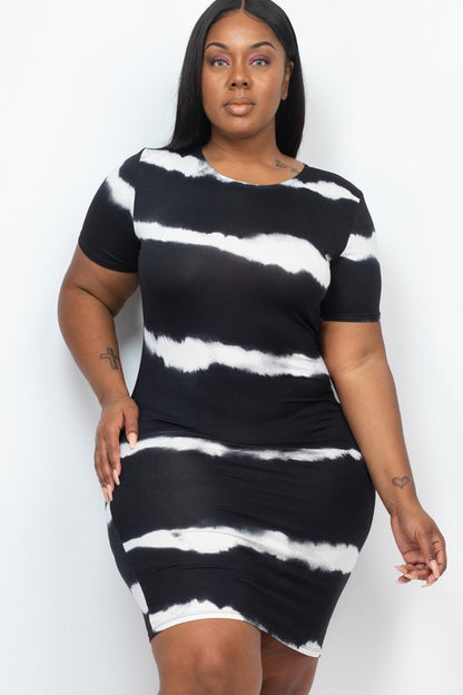 Woman wearing a stripe tie-dye midi dress with short sleeves and lace detail, styled against a white background