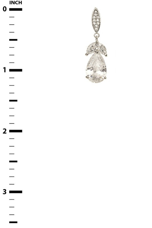 The image features a single earring placed next to a vertical measurement scale marked in inches, ranging from 0 to 3.