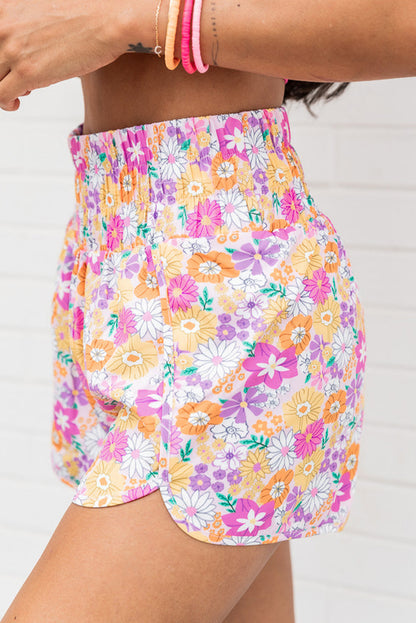 Floral, flirty, and free-spirited. These pink boho shorts are your go-to for warm-weather adventures, featuring a shirred high waist and a relaxed fit that flatters every curve. Whether you're headed to a beach day, brunch, or a music festival, these shorts bring effortless style and comfort.