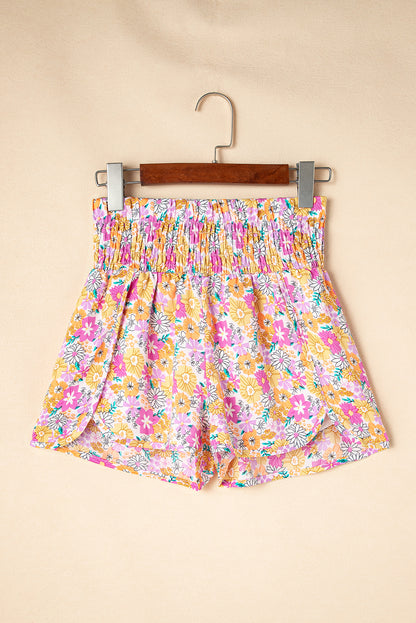 Floral, flirty, and free-spirited. These pink boho shorts are your go-to for warm-weather adventures, featuring a shirred high waist and a relaxed fit that flatters every curve. Whether you're headed to a beach day, brunch, or a music festival, these shorts bring effortless style and comfort.