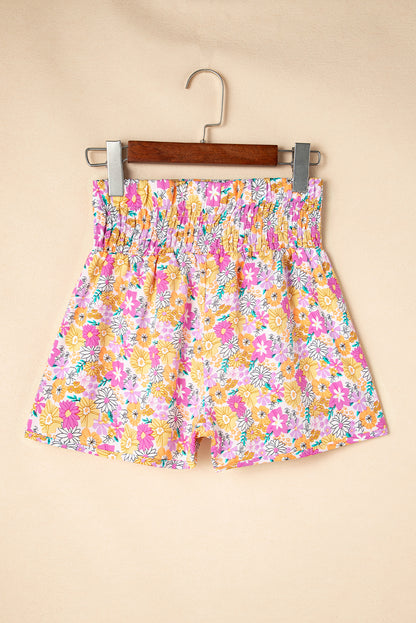 Floral, flirty, and free-spirited. These pink boho shorts are your go-to for warm-weather adventures, featuring a shirred high waist and a relaxed fit that flatters every curve. Whether you're headed to a beach day, brunch, or a music festival, these shorts bring effortless style and comfort.