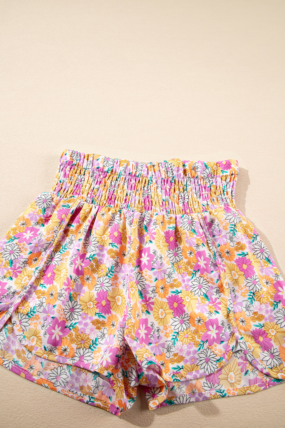 Floral, flirty, and free-spirited. These pink boho shorts are your go-to for warm-weather adventures, featuring a shirred high waist and a relaxed fit that flatters every curve. Whether you're headed to a beach day, brunch, or a music festival, these shorts bring effortless style and comfort.