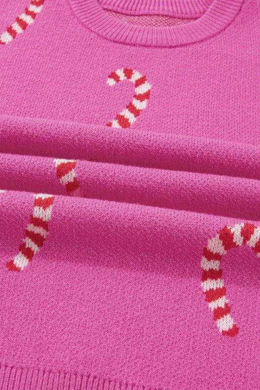 Pink candy cane patterned sweater shown