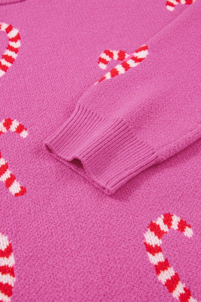 Pink candy cane patterned sweater displayed